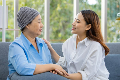 senior patient with cancer talking with caregiver