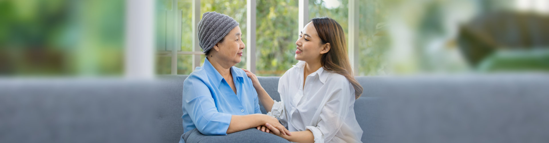 senior patient with cancer talking with caregiver
